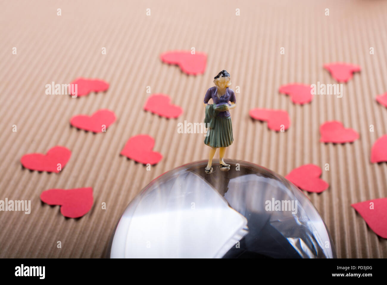 Woman figurine and Love concept with red paper hearts Stock Photo - Alamy