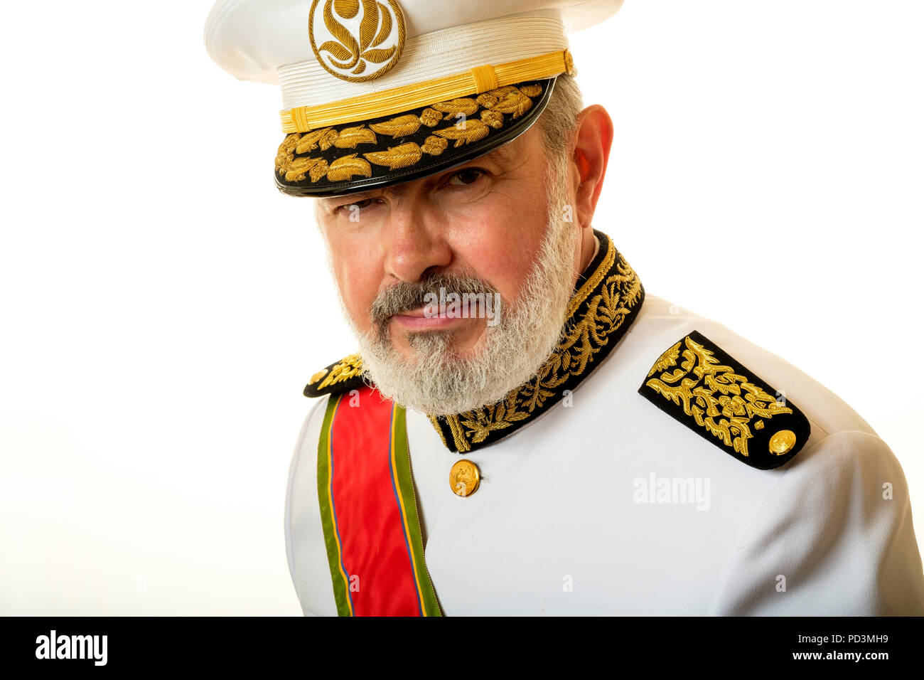 Fictional character : Governor Babala with white full uniform, red honorific sash and officer's cap, Stock Photo