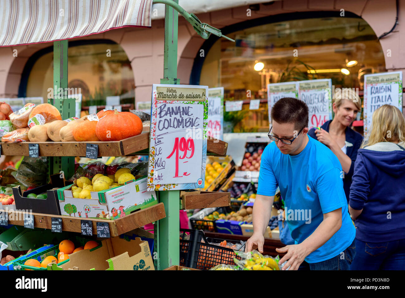 Shop assistant at grocery fruits stall, Strasbourg, Alsace, France, Europe, Stock Photo