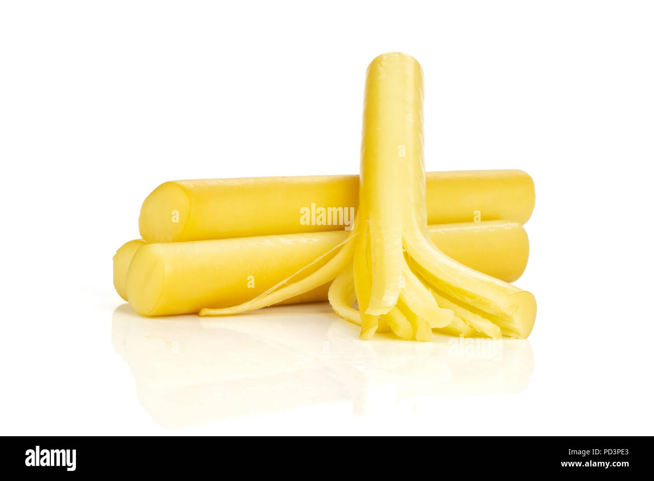 Group of three whole smoked slovak string cheese stick thick shreds