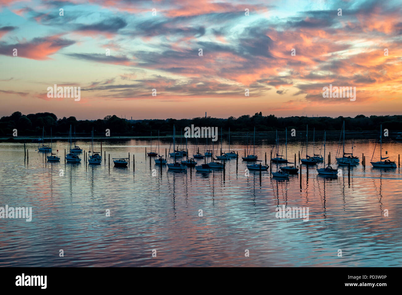 dusk at Portsmouth Harbour, Portchester reach with yachts moored. Stock Photo