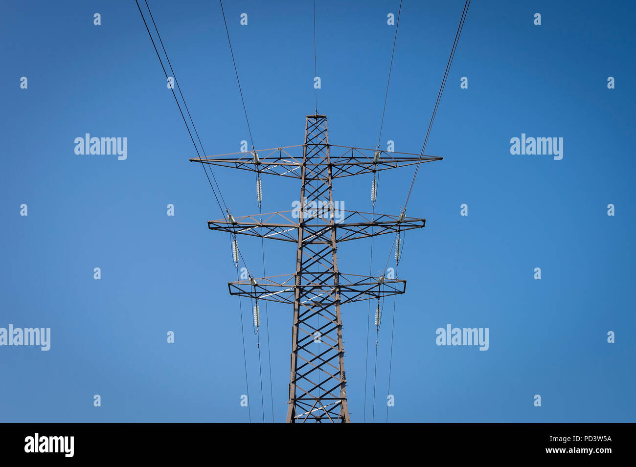 electricity pylon with blue sky Stock Photo - Alamy