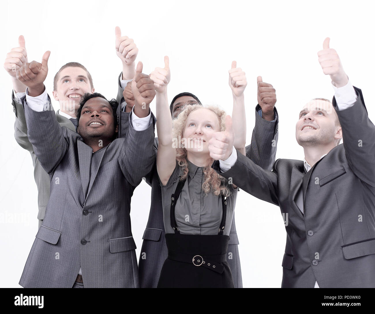 closeup.international business team showing thumbs up Stock Photo - Alamy