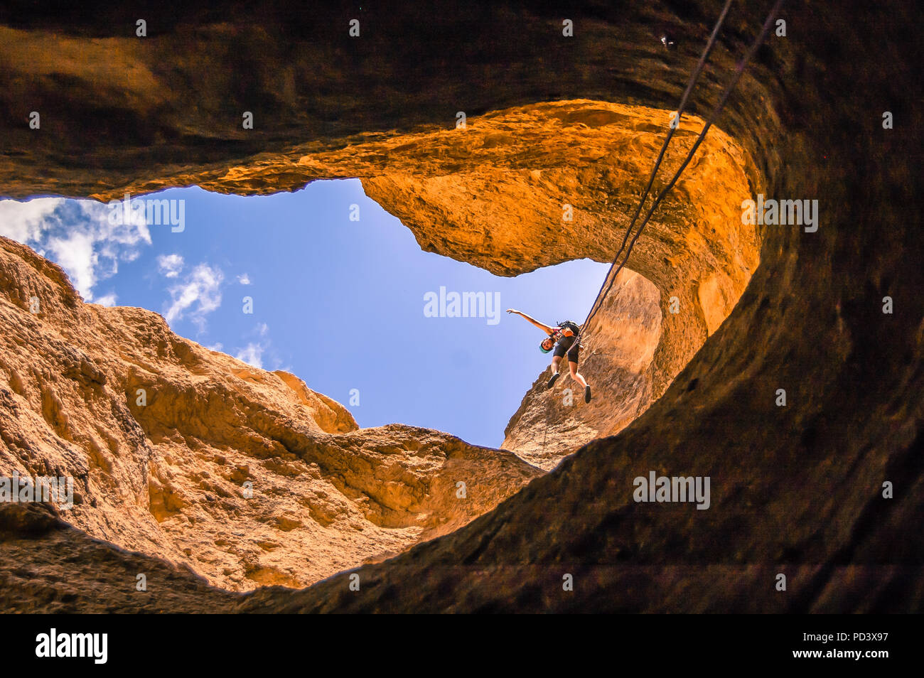 Man abseiling, low angle view, Smith Rock State Park, Terrebonne, Oregon, United States Stock Photo