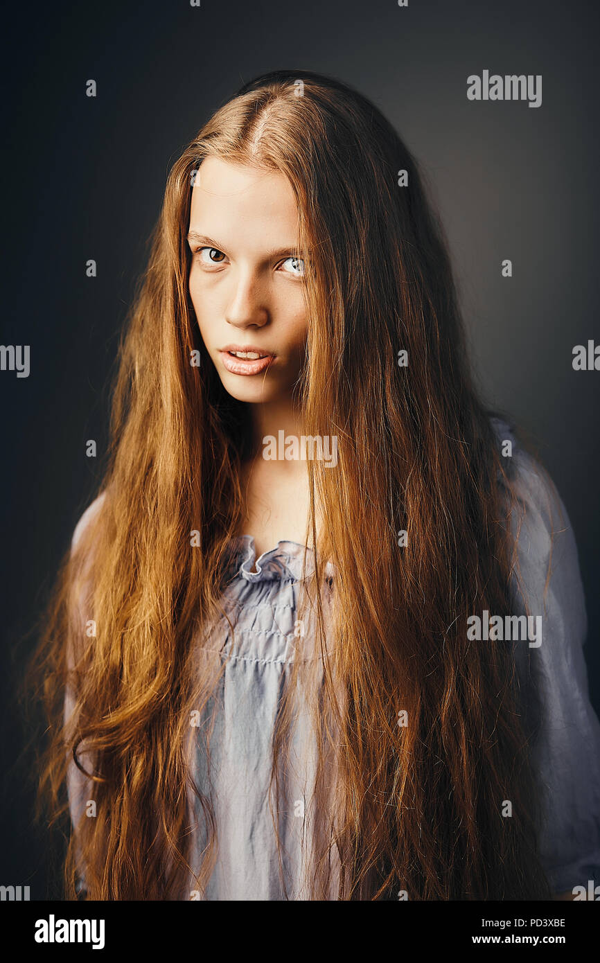 Young woman, grey background Stock Photo - Alamy