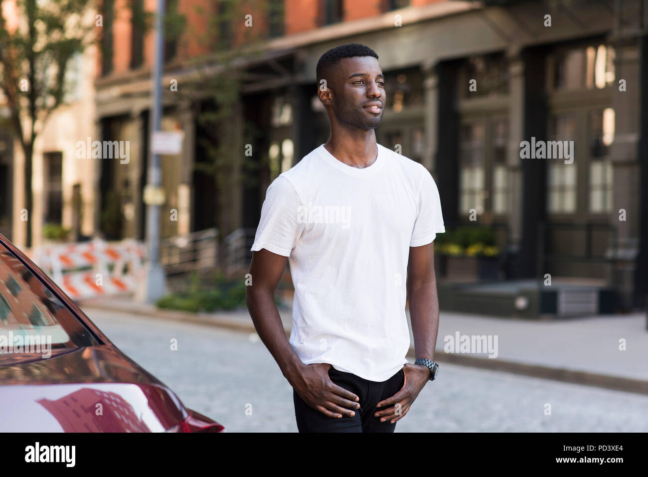 Young man in streets of New York, US Stock Photo