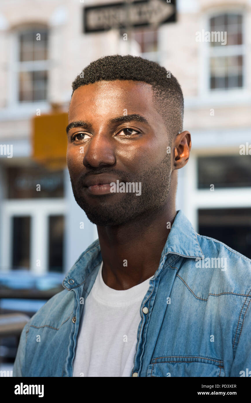 Young man in streets of New York, US Stock Photo