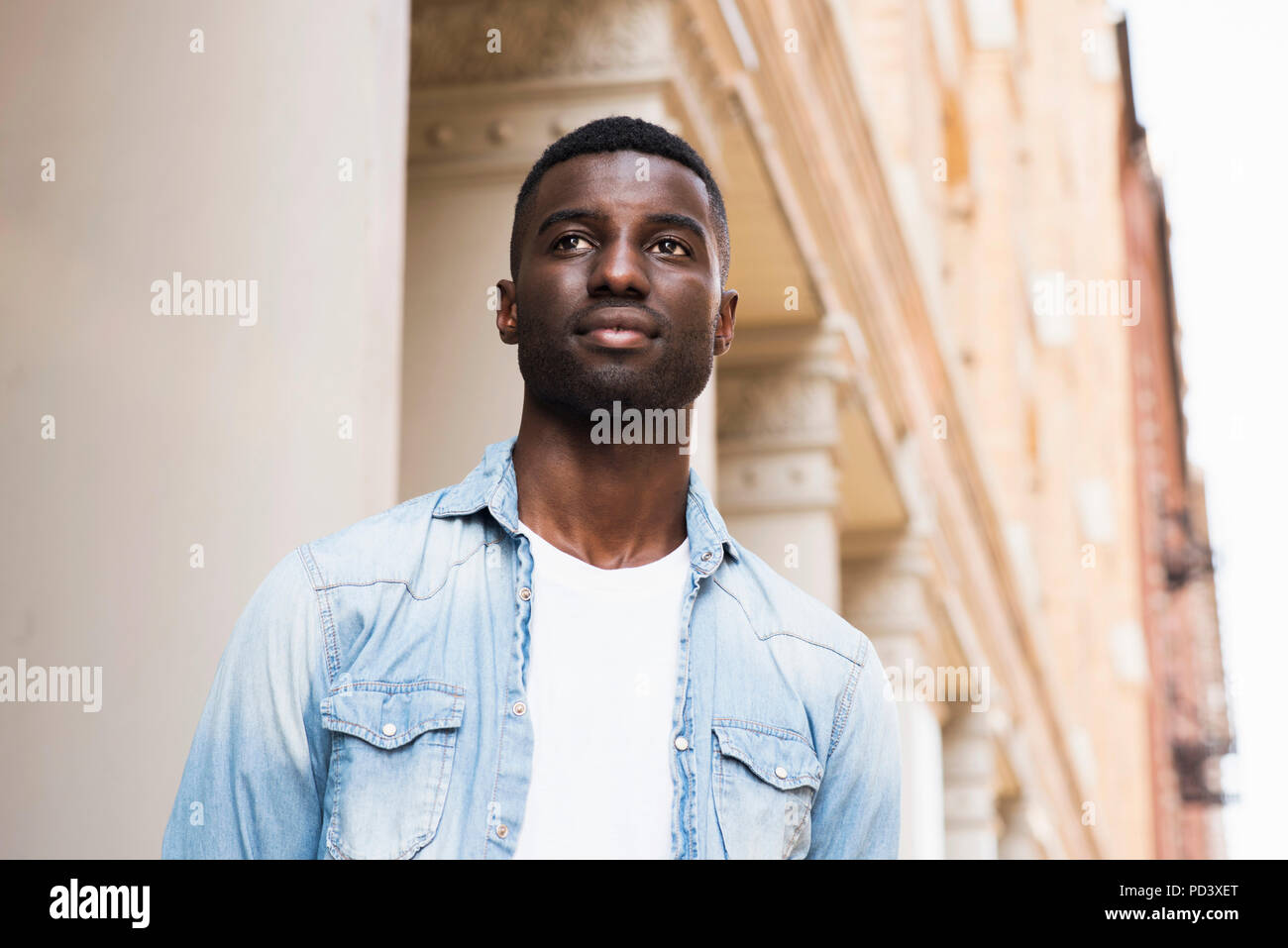 Young man in streets of New York, US Stock Photo