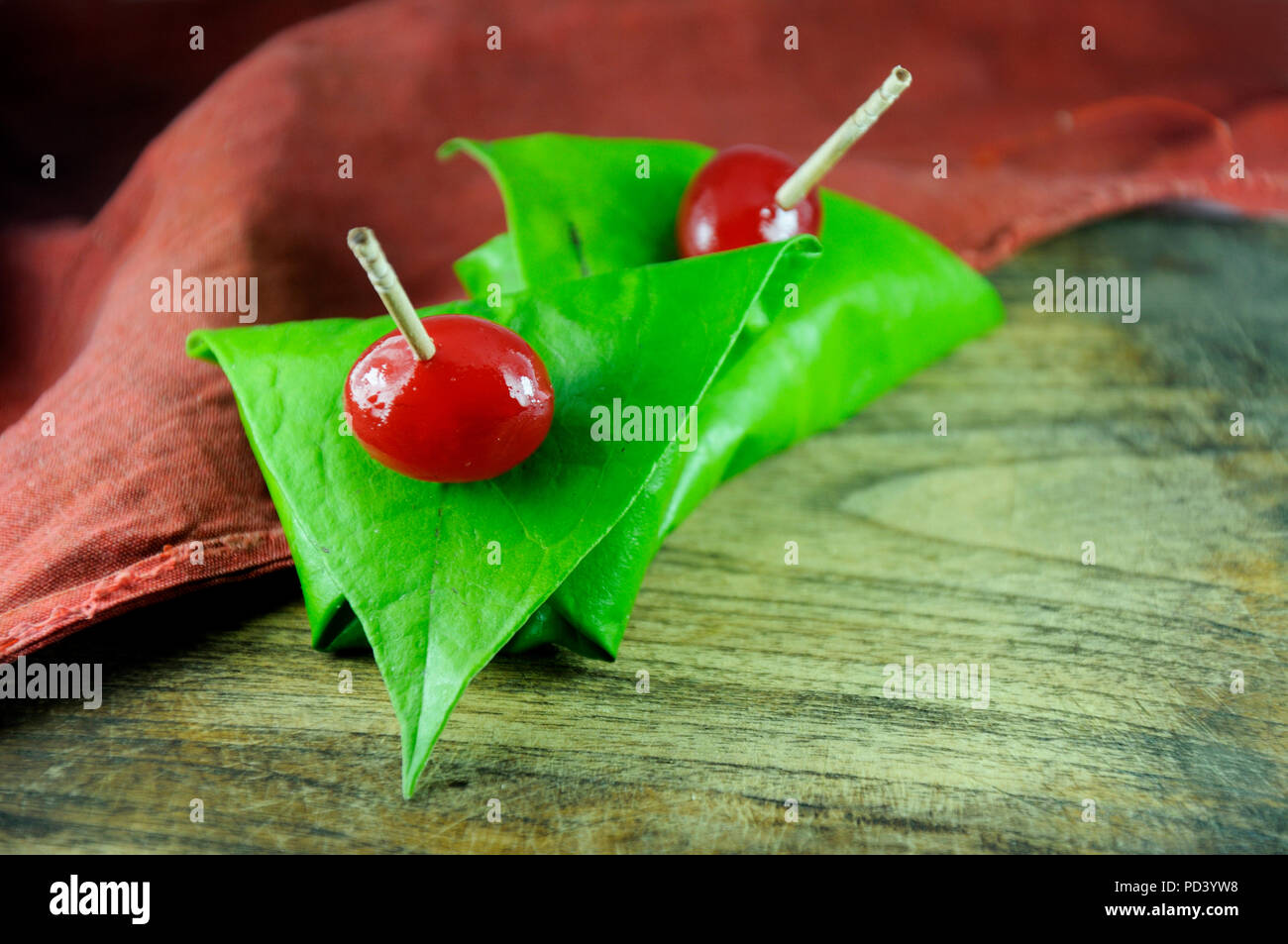 sweet paan wrapped in betel leaf, often used as an after dinner digestive. Stock Photo