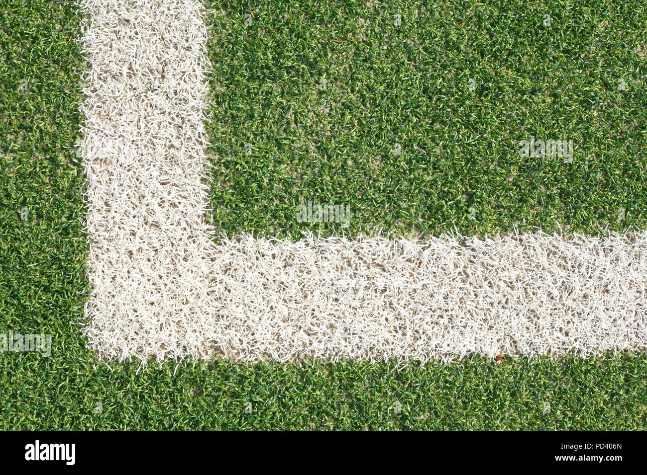 Corner, sideline, chalk marker on the grass on a football field Stock Photo  - Alamy