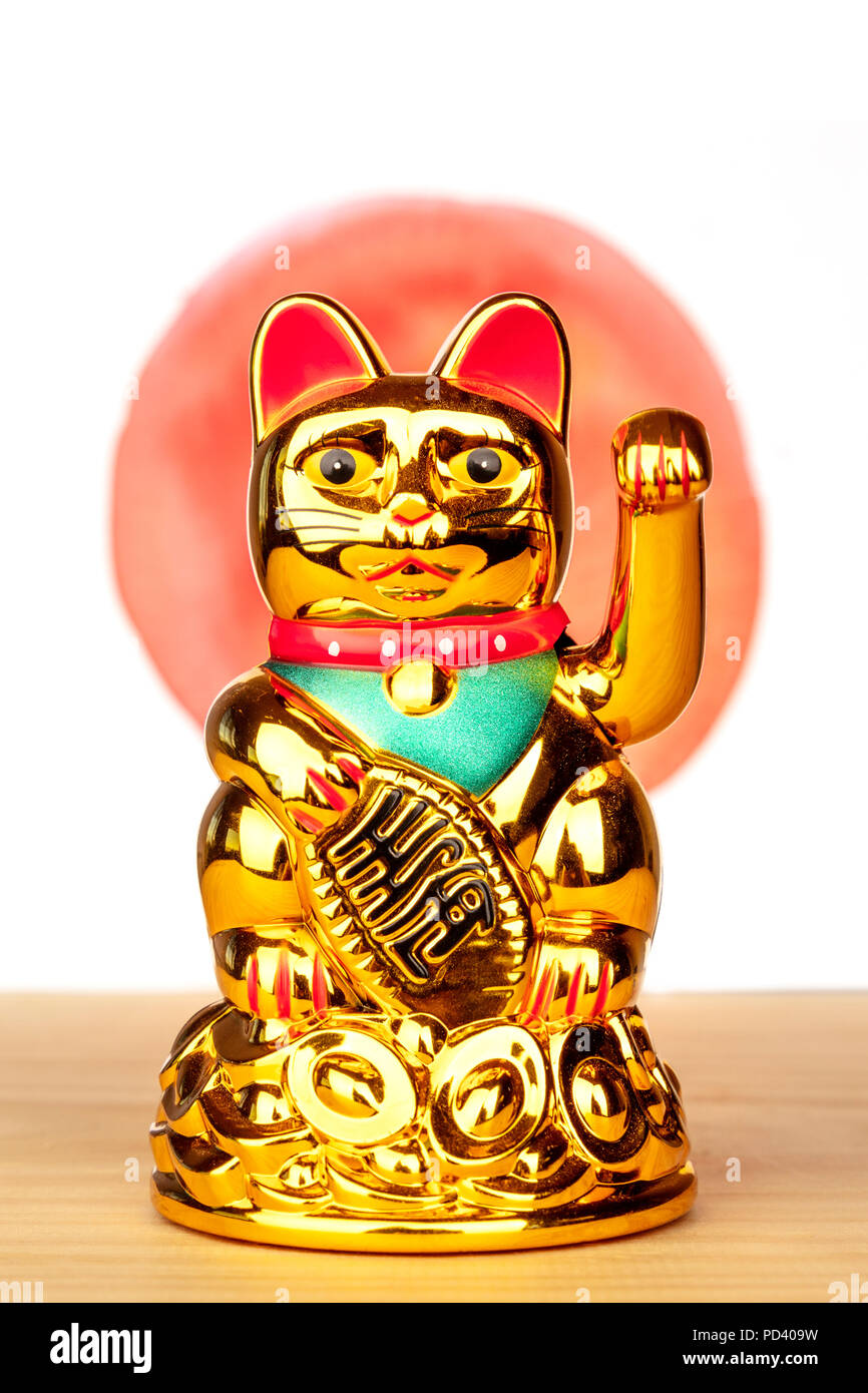 A photo of maneki neko, a Japanese lucky beckoning cat figurine, on