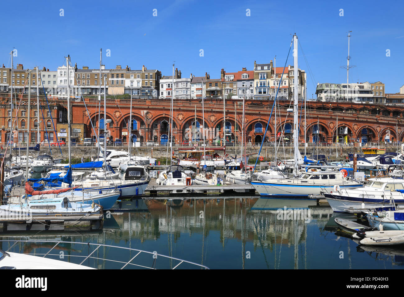 The harbour in front of the Victorian arches, in the coastal town of ...