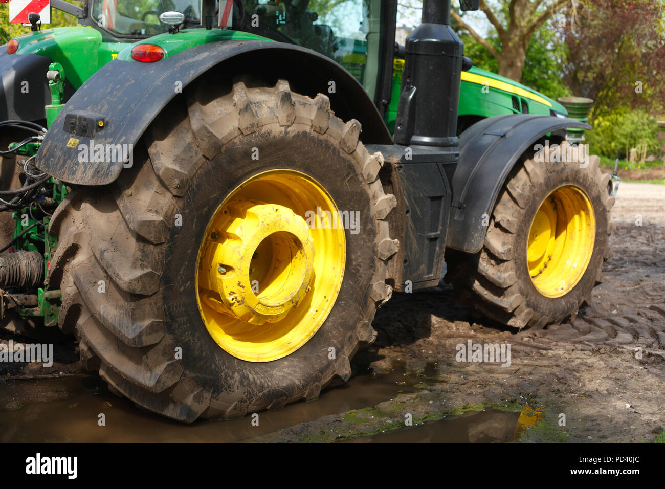 Tractor, Black Tractor Tires, Yellow Hubcaps Stock Photo Alamy