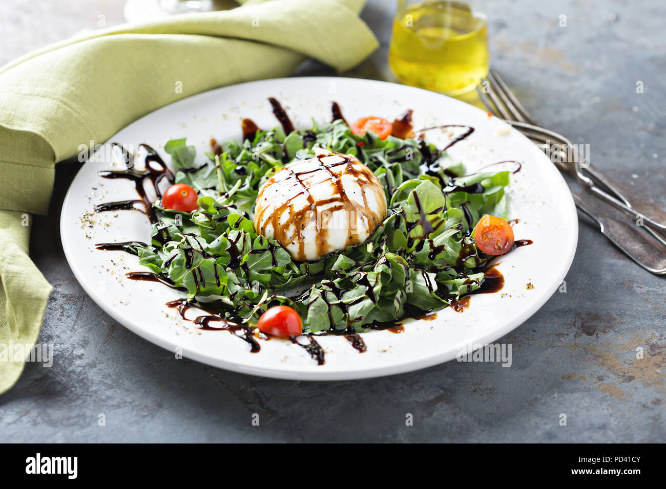 Burrata and arugula salad with balsamic vinegar Stock Photo