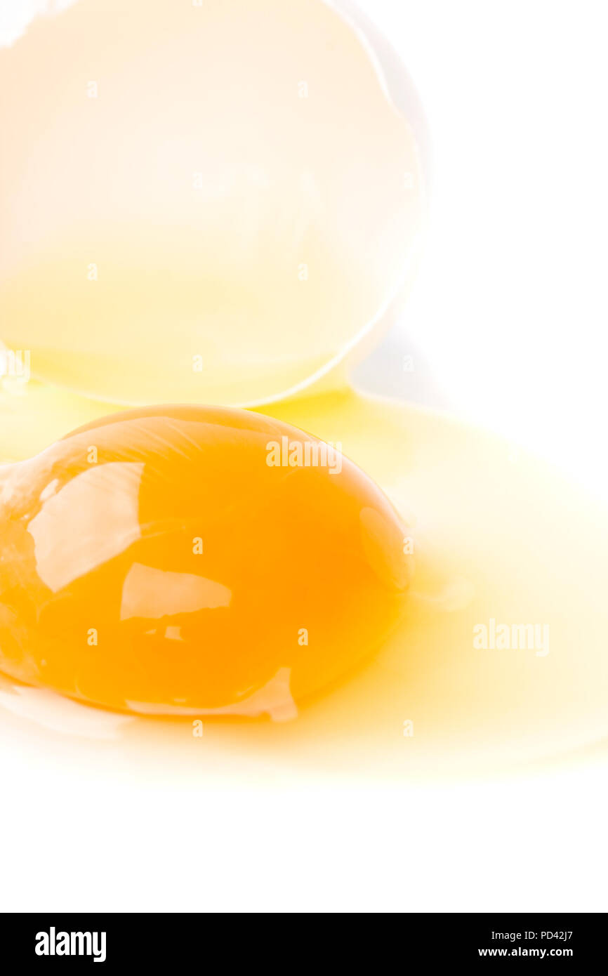 broken egg closeup white background Stock Photo - Alamy
