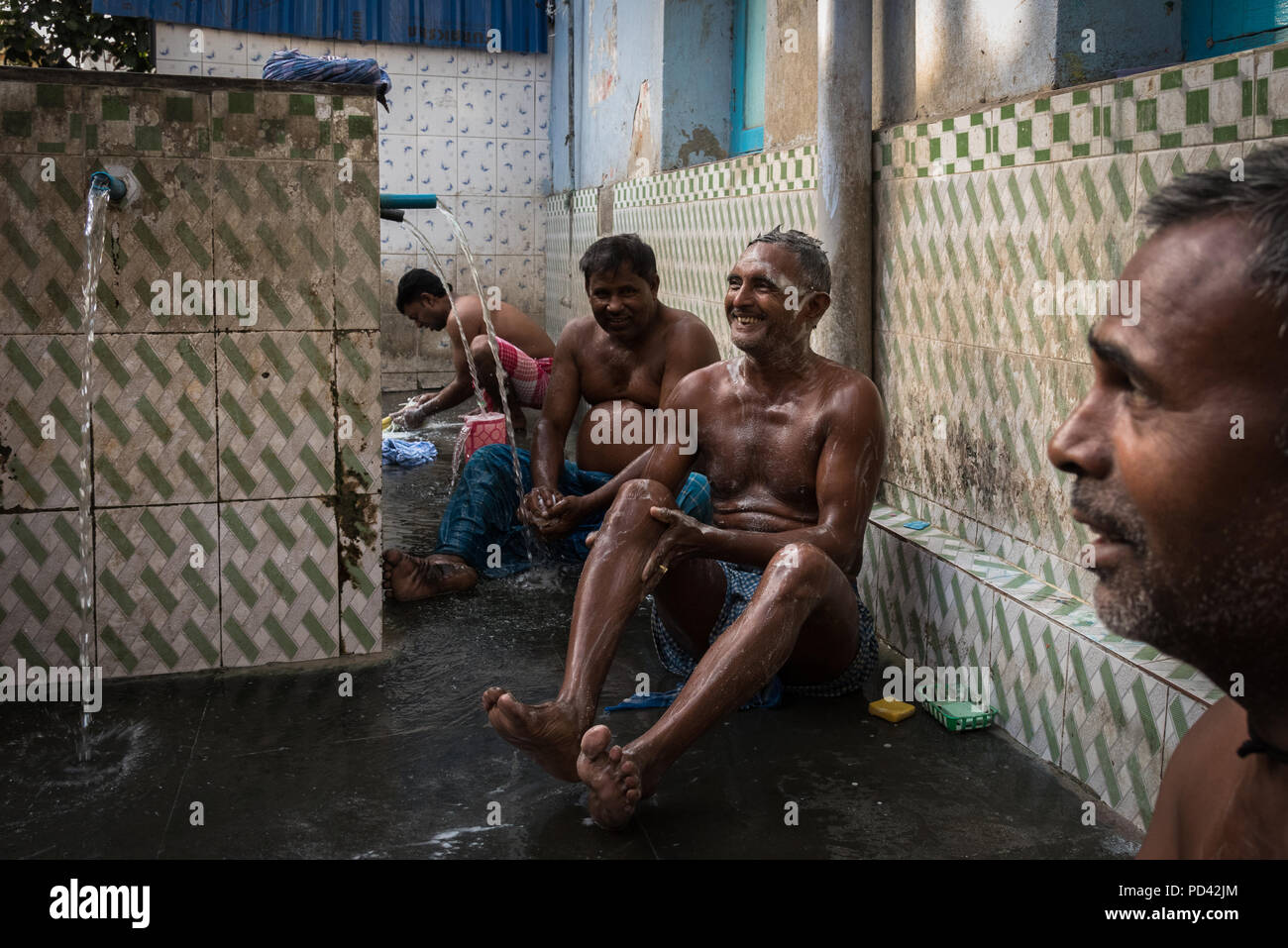 Men washing in a public bathing spot, Kolkata, India Stock Photo Alamy
