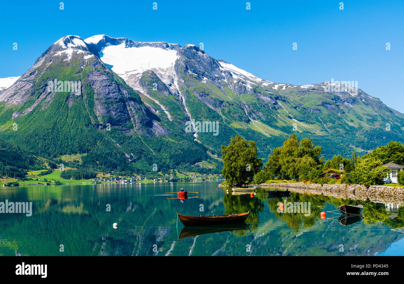 Hjelle, Western Norway, beautifully situated by the lake Oppstrynsvatnet. Stock Photo