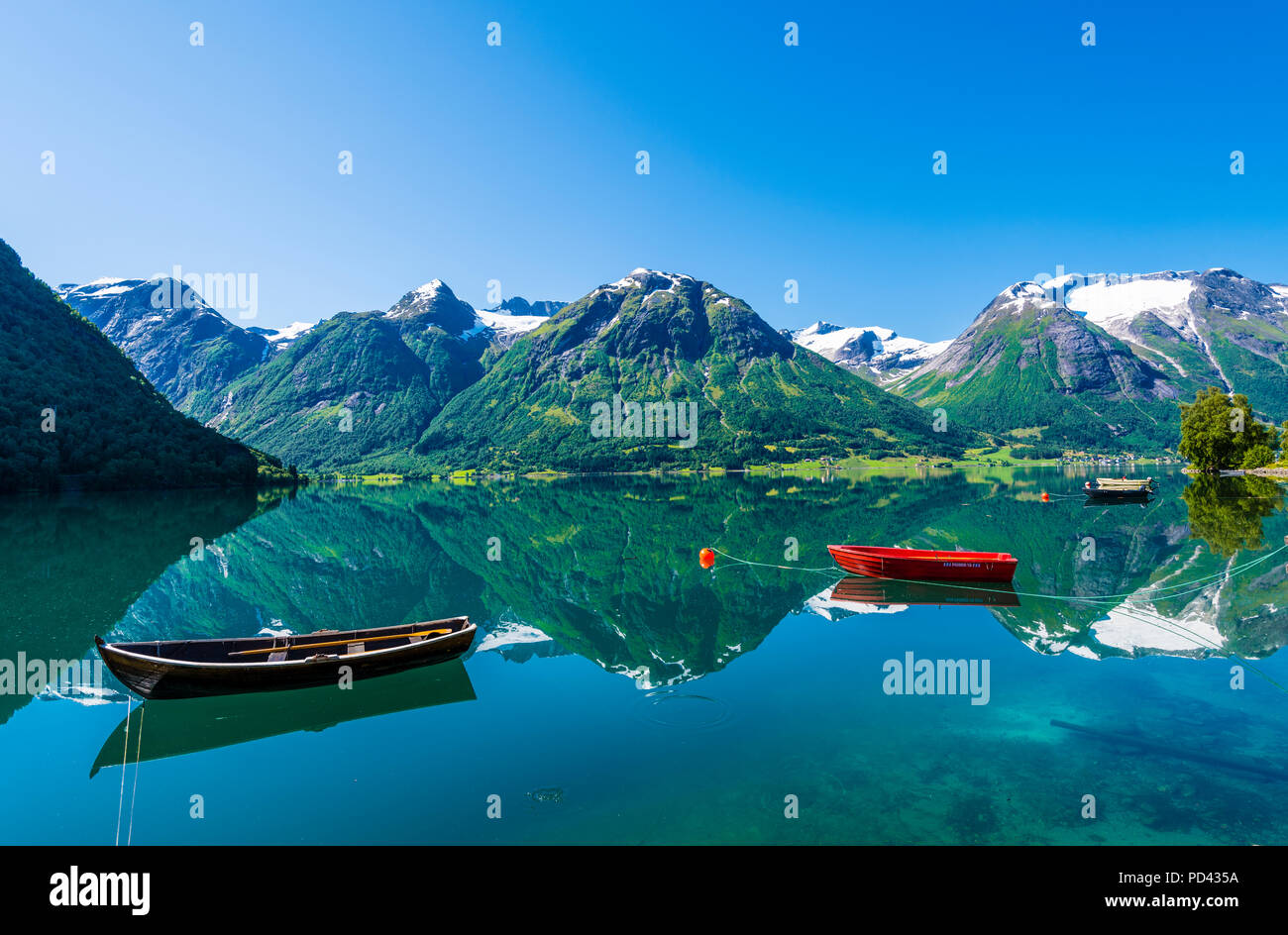 Hjelle, Western Norway, beautifully situated by the lake Oppstrynsvatnet. Stock Photo