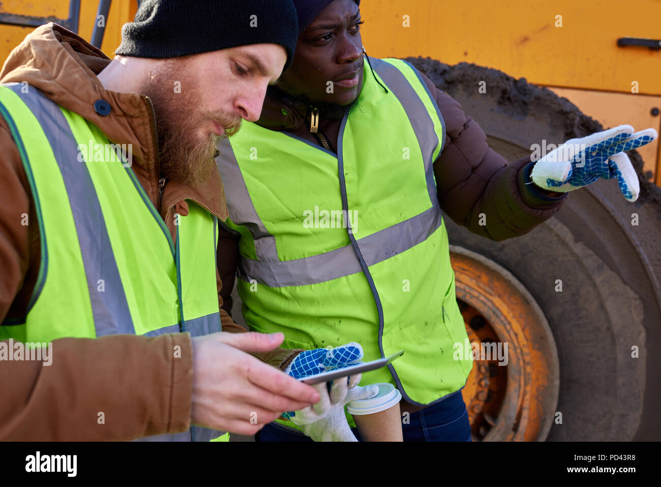 Two Miners using Tablet Stock Photo