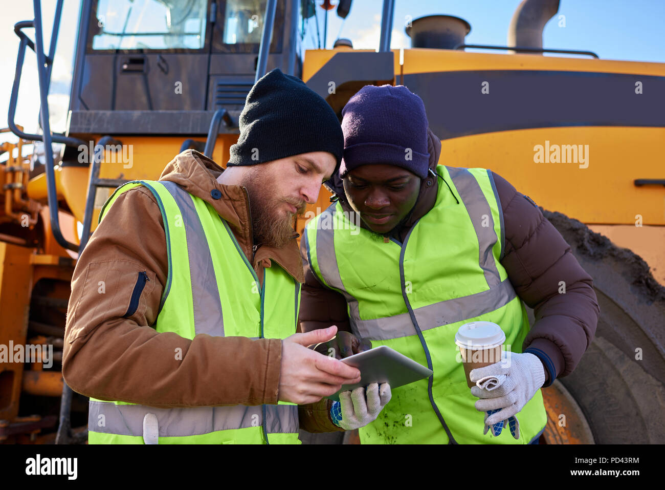 Miners Using Tablet on Site Stock Photo