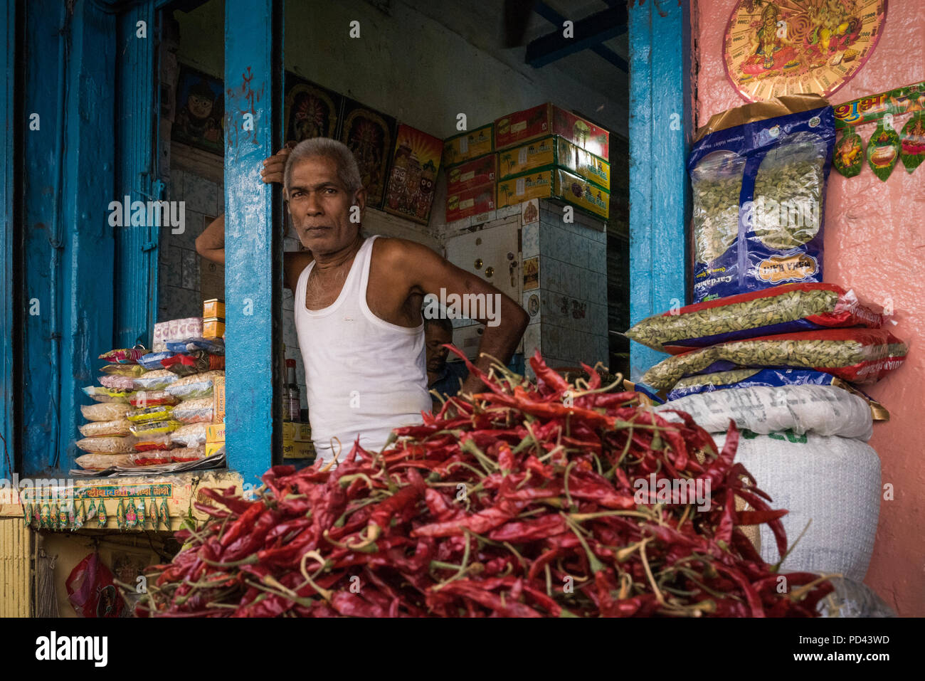 A spice vendor standing in front of his spice shop in Kolkata, Stock Photo
