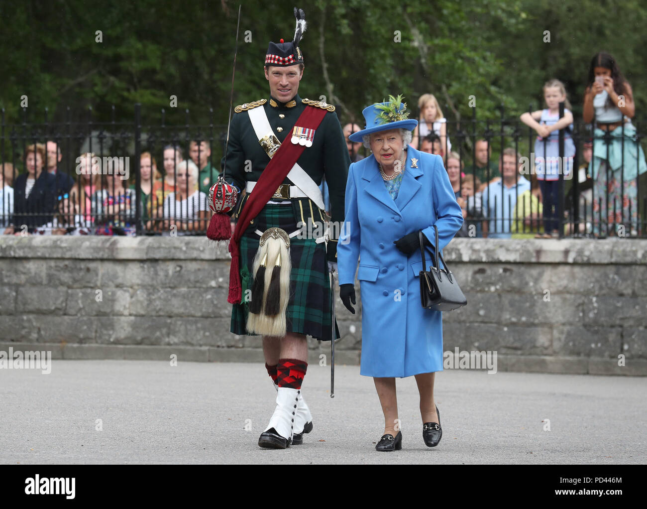 Queen Elizabeth II, with Officer Commanding Major Johnny Thompson