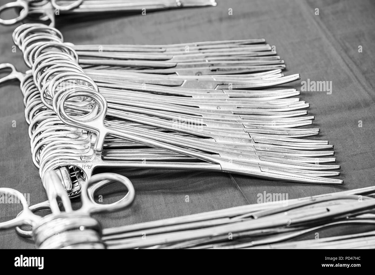 Sterile surgical instruments on the table. Forceps Stock Photo