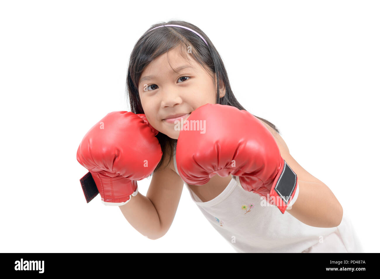 Smile girl fighting with red boxing gloves isolated on white background, exercise and healthy concept Stock Photo