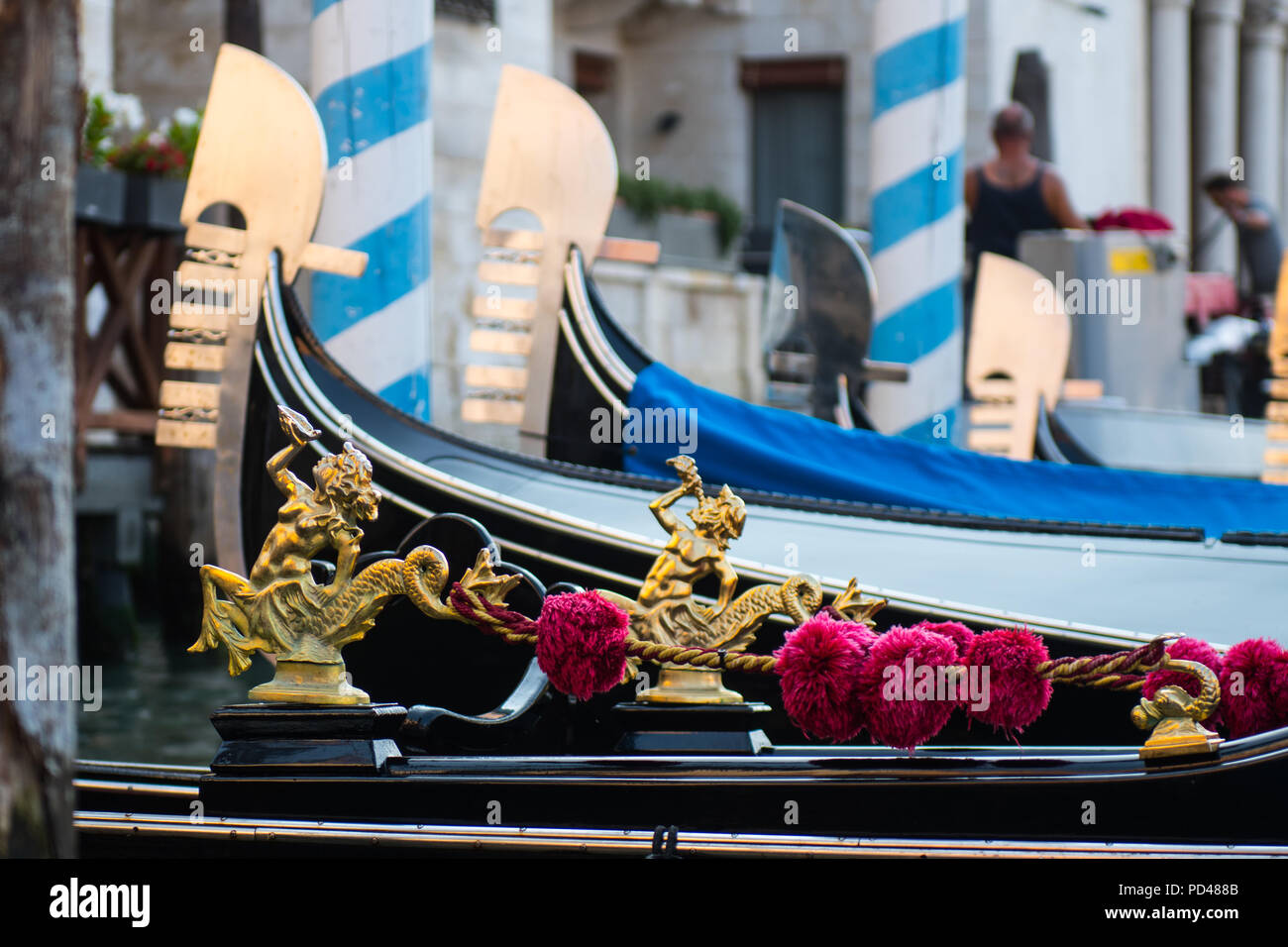 Golden decoration of the gondola, with bricolas and the symbol of the