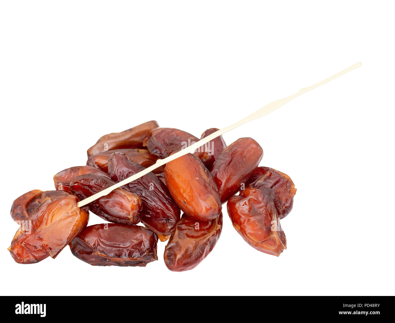 Dried dates with plastic stick, stem, isolated on white background Stock Photo