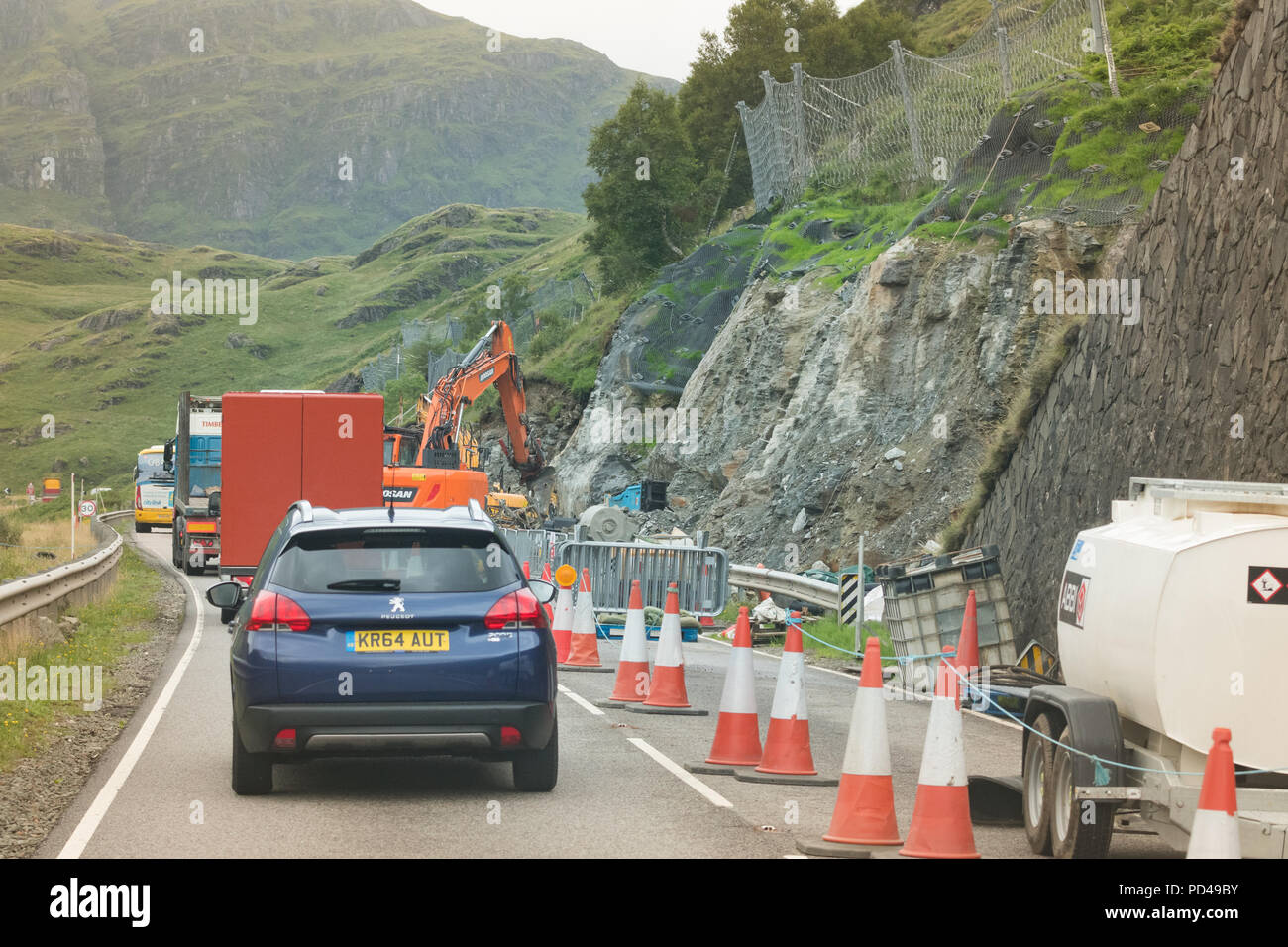 Rest and be thankful A83 road, Scotland, UK - excavating debris flow catch-pits to help reduce road closures due to landslides Stock Photo