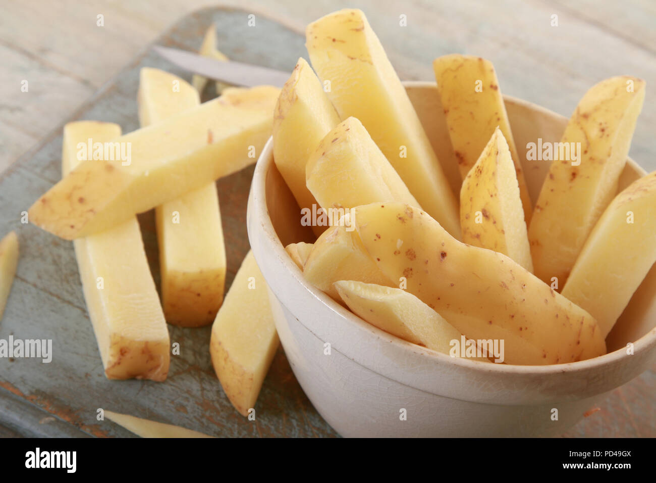 Chipping potatoes hires stock photography and images Alamy