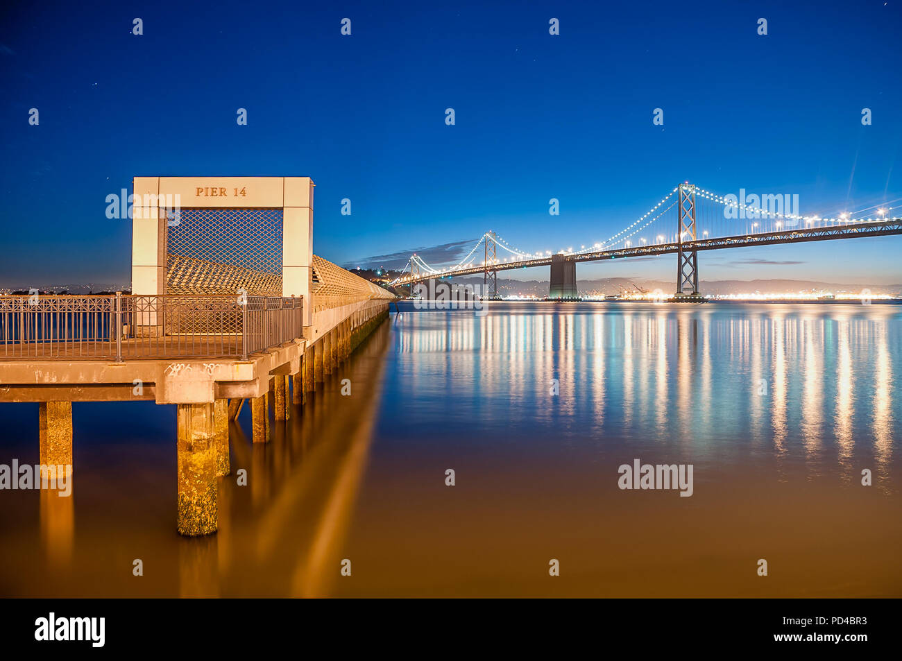 The Bay Bridge and Pier 14 at Blue Hour Stock Photo