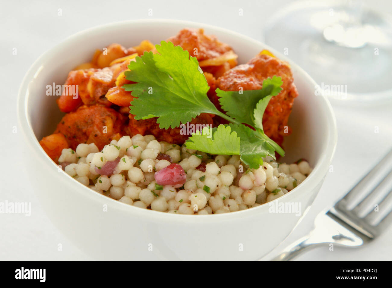 moroccan chicken tagine with giant couscous Stock Photo Alamy