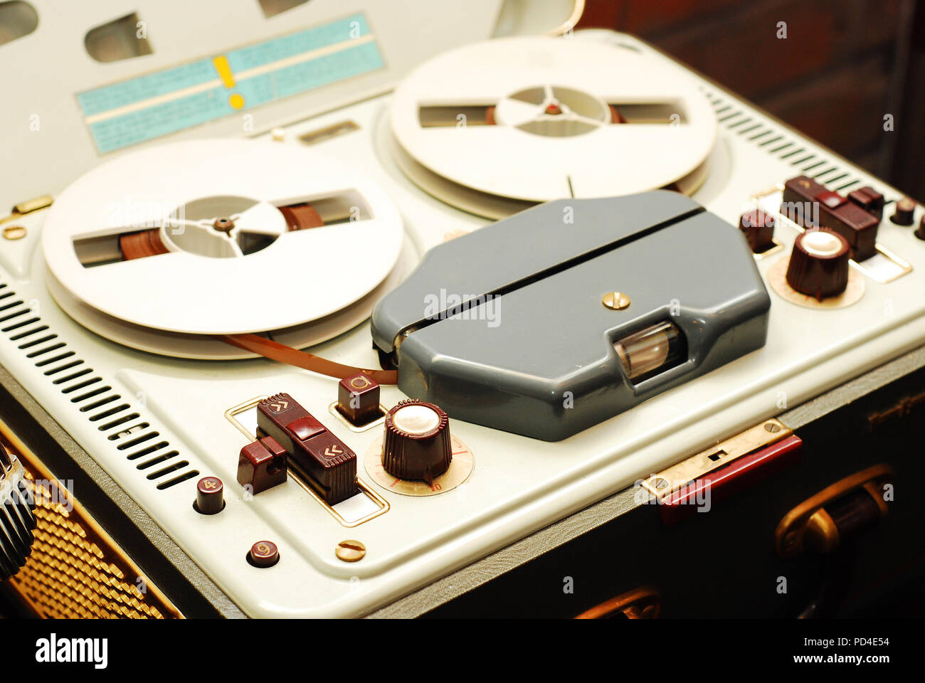 Old reel-to-reel recorder with magnetic tape on it Stock Photo - Alamy