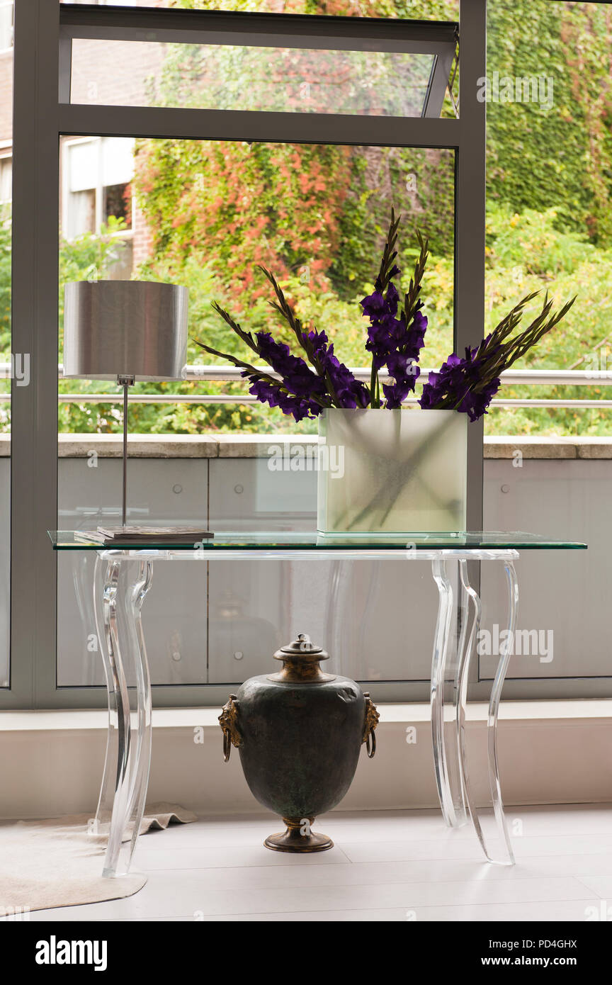 Flower arrangement in vase on table Stock Photo