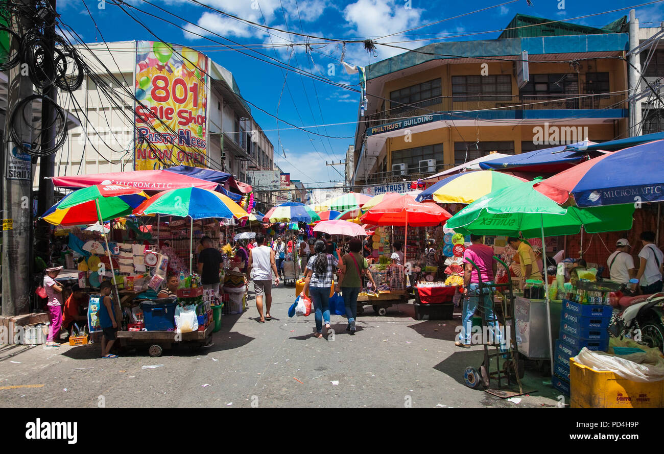 MANILA, PHILIPPINES - APR 1, 2016. People at street market in Manila on