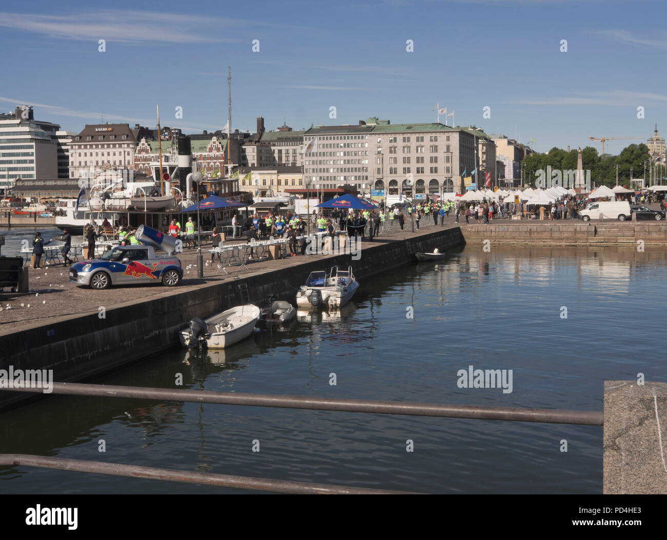 Kauppatori, the Market square in the centre of Helsinki Finland with partisipants in the Half Marathon passing Stock Photo