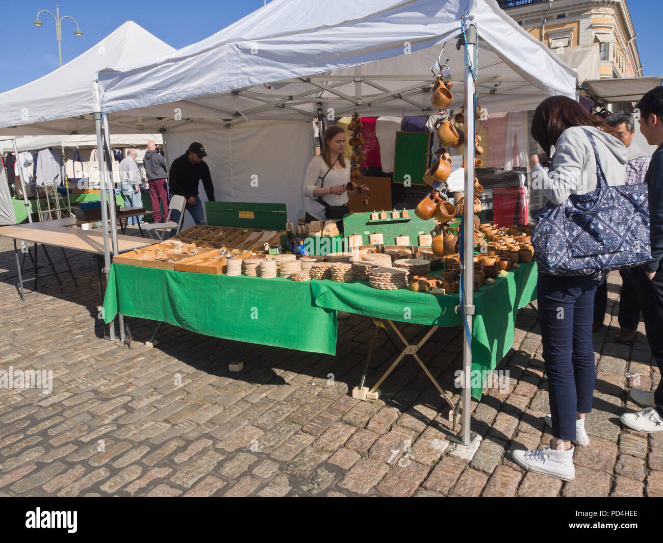 Traditional wooden craft products sold for tourists at the Kauppatori market square in central Helsinki Finland Stock Photo