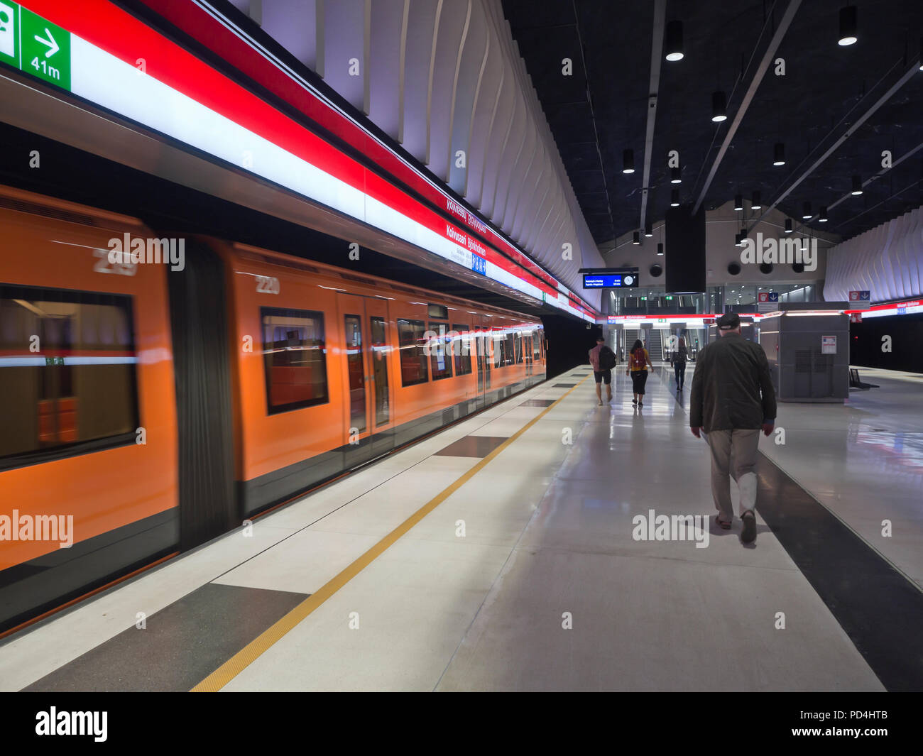 Helsinki Metro system running from eastern to western suburbs in Finlands capital, platform, passengers  and train at Koivusaaren station Stock Photo
