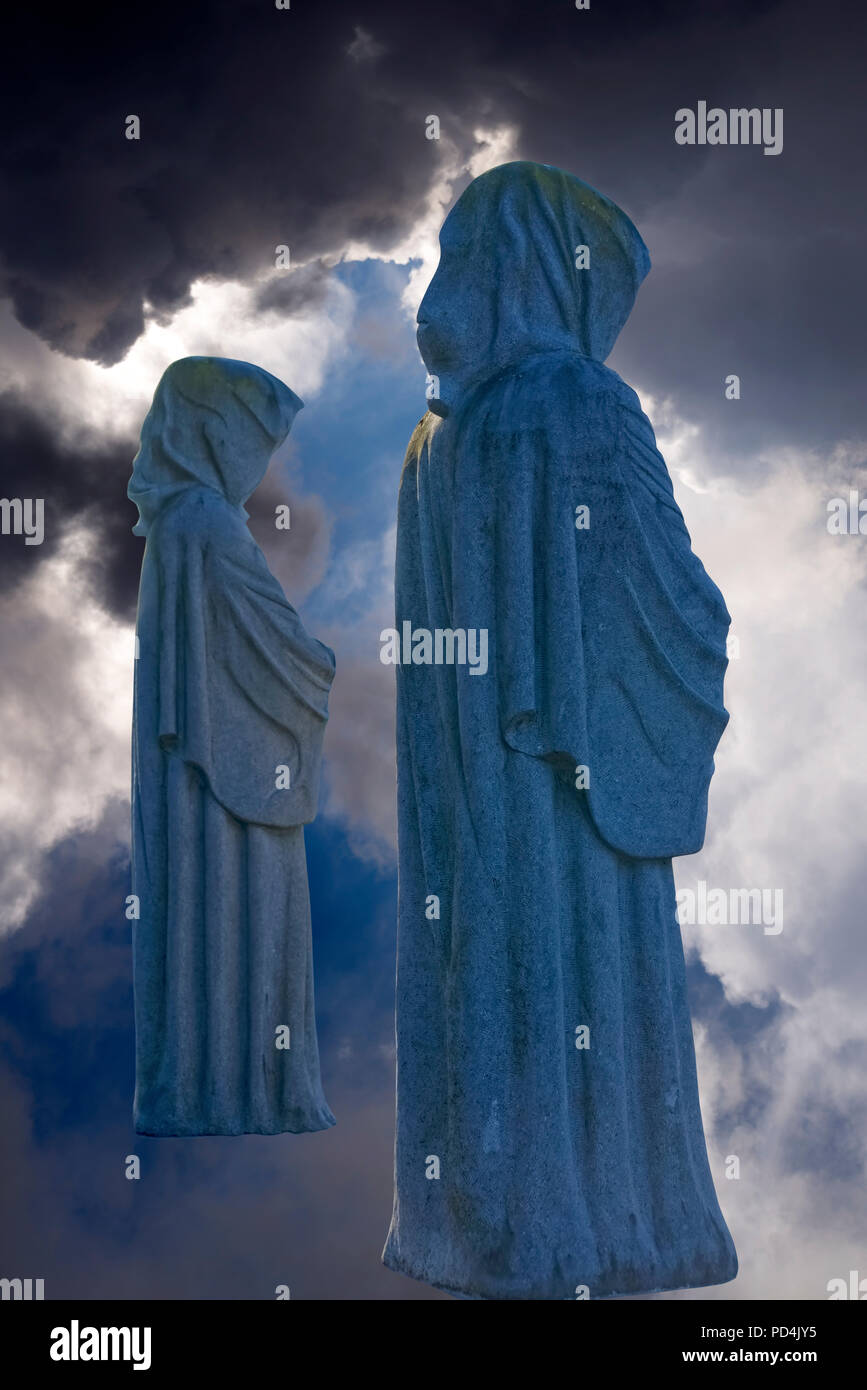 faceless monk statues at the town of fermoy in county cork ireland with clipping path Stock Photo