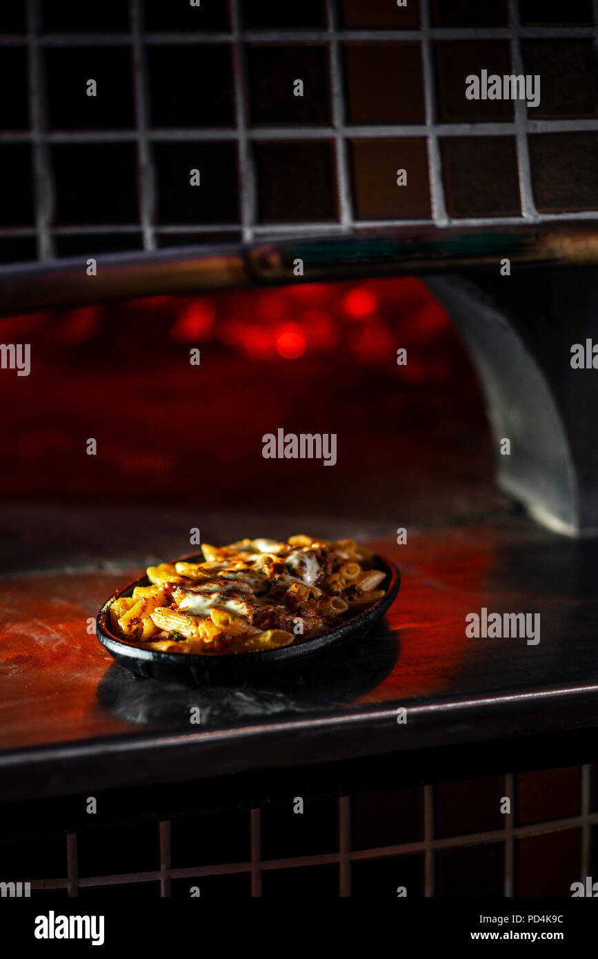 gourmet wood fired oven baked fresh pasta penne bolognese and