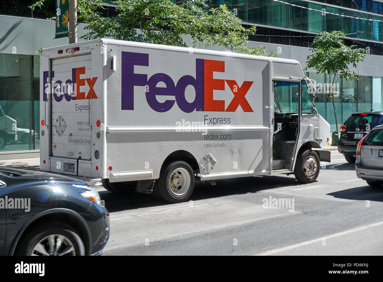 TORONTO, CANADA - JULY 15, 2018: FedEx truck on a Toronto street, Ontario, Canada. FedEx Corporation is an American multinational courier delivery ser Stock Photo