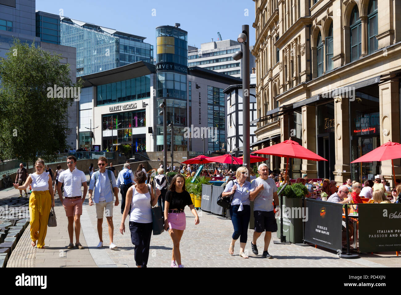 People dining outside the Corn Exchange, in Exchange Square Manchester. Stock Photo