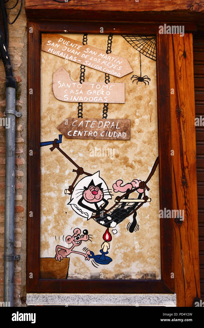 Amusing Tom and Jerry cartoon street sign showing tourist attractions, Toledo, Castile-La Mancha, Spain Stock Photo