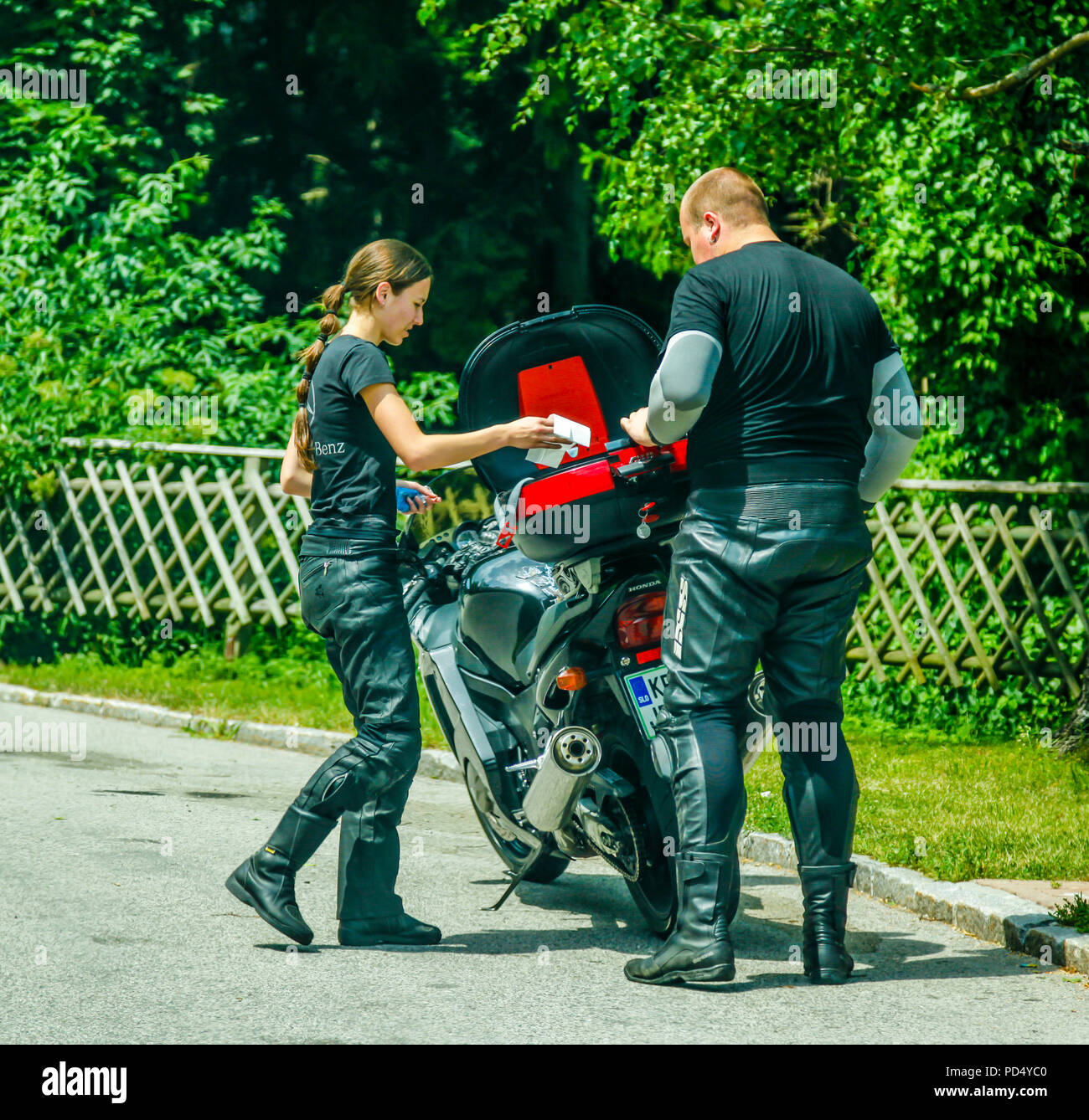 Young woman riding pillion hi-res stock photography and images - Alamy