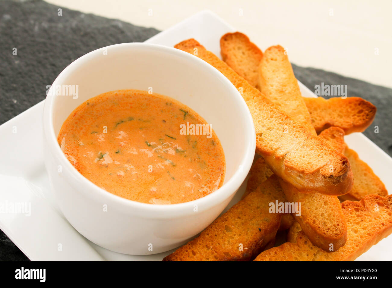 sun dried tomato dip with toasted bread Stock Photo Alamy