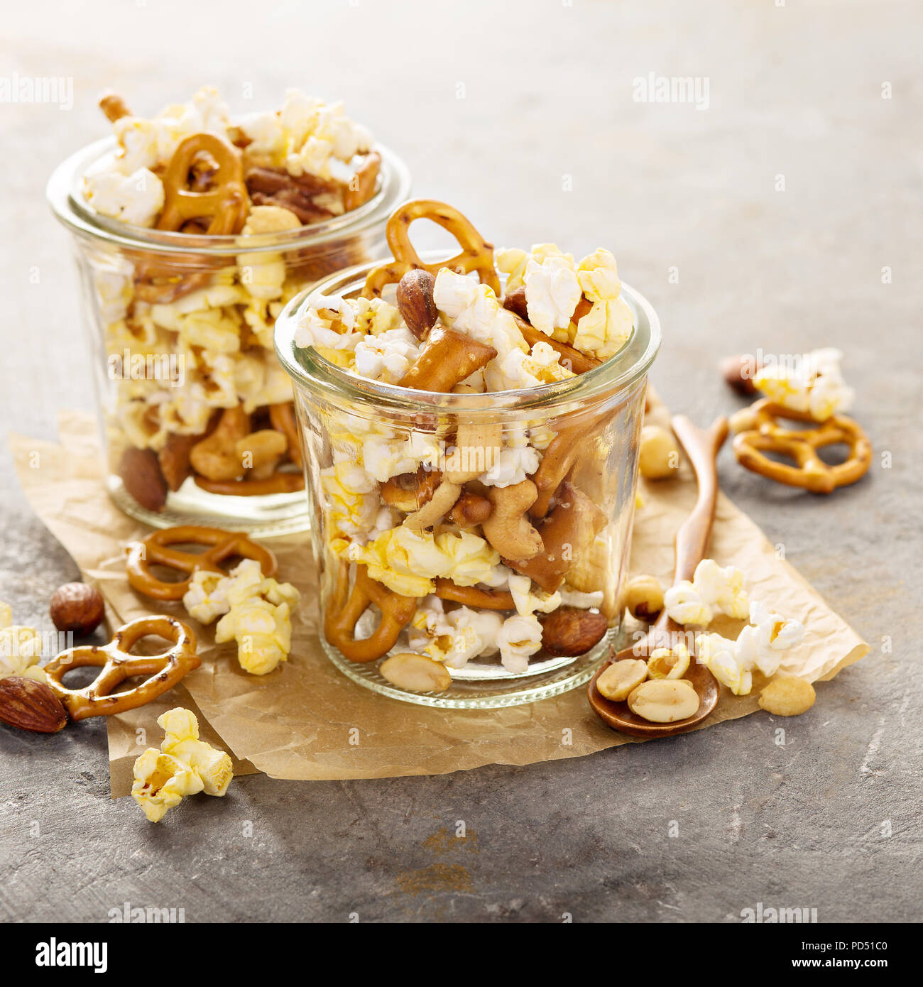 Trail mix with nuts, popcorn and pretzels Stock Photo Alamy