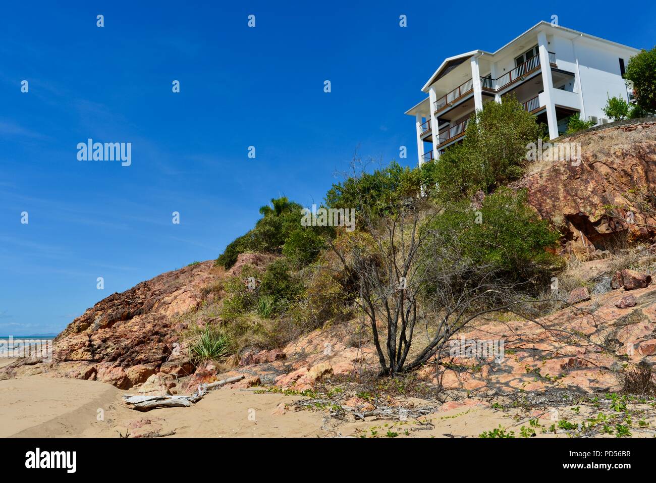 Large white house on a beach, coastal property, Toomulla QLD, Australia