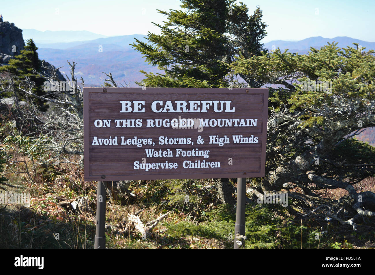 Warning Sign On Top of Grandfather Mountain States, 'Be Careful On This Rugged Mountain ...' Stock Photo